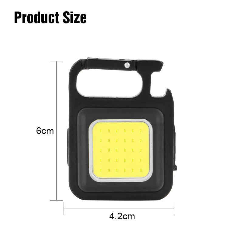 Black aluminium alloy USB rechargeable keychain torch with magnetic base and foldable handle.