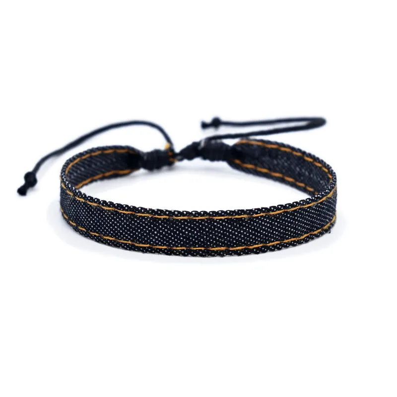 Denim fabric bracelet carrying strap with mixed material construction in unisex design
