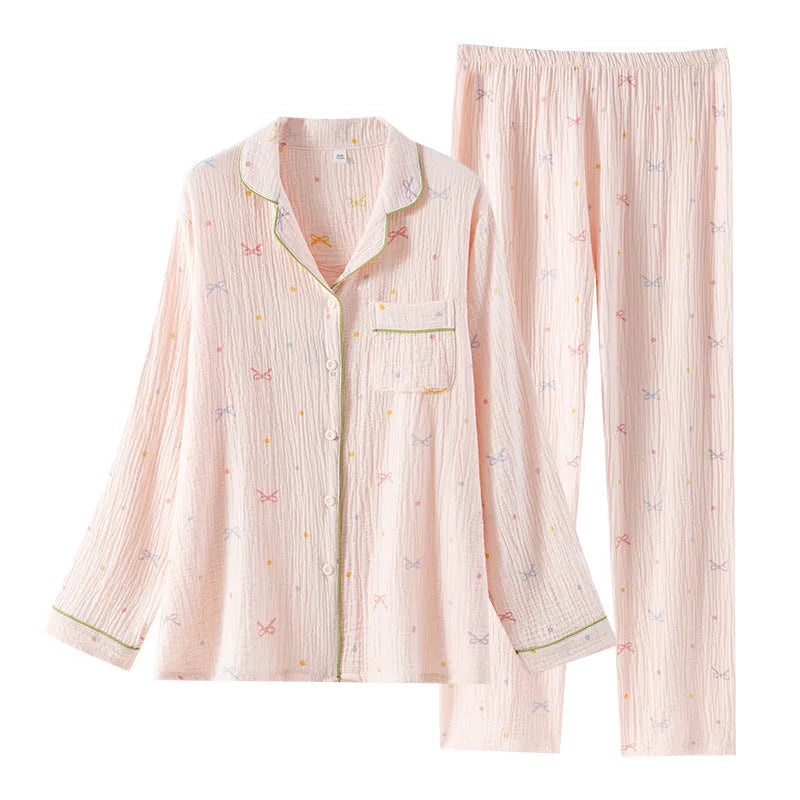 Women's long sleeve cotton pajama set in pink, featuring a top and trousers for sleepwear.