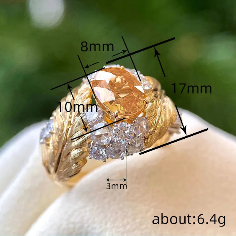 Gold colour feather embossed copper ring with yellow zircon stones in geometric design