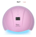 Metallic gold foil number 5 balloon and pink star balloon floating with helium ribbon.