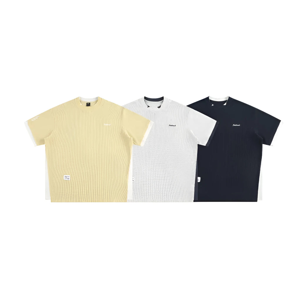 Loose-fitting short-sleeved waffle t-shirt with retro alphabet embroidery in yellow.