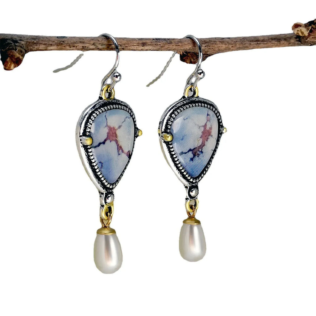 Women's lavender turquoise and white pearl drop earrings with geometric retro design.
