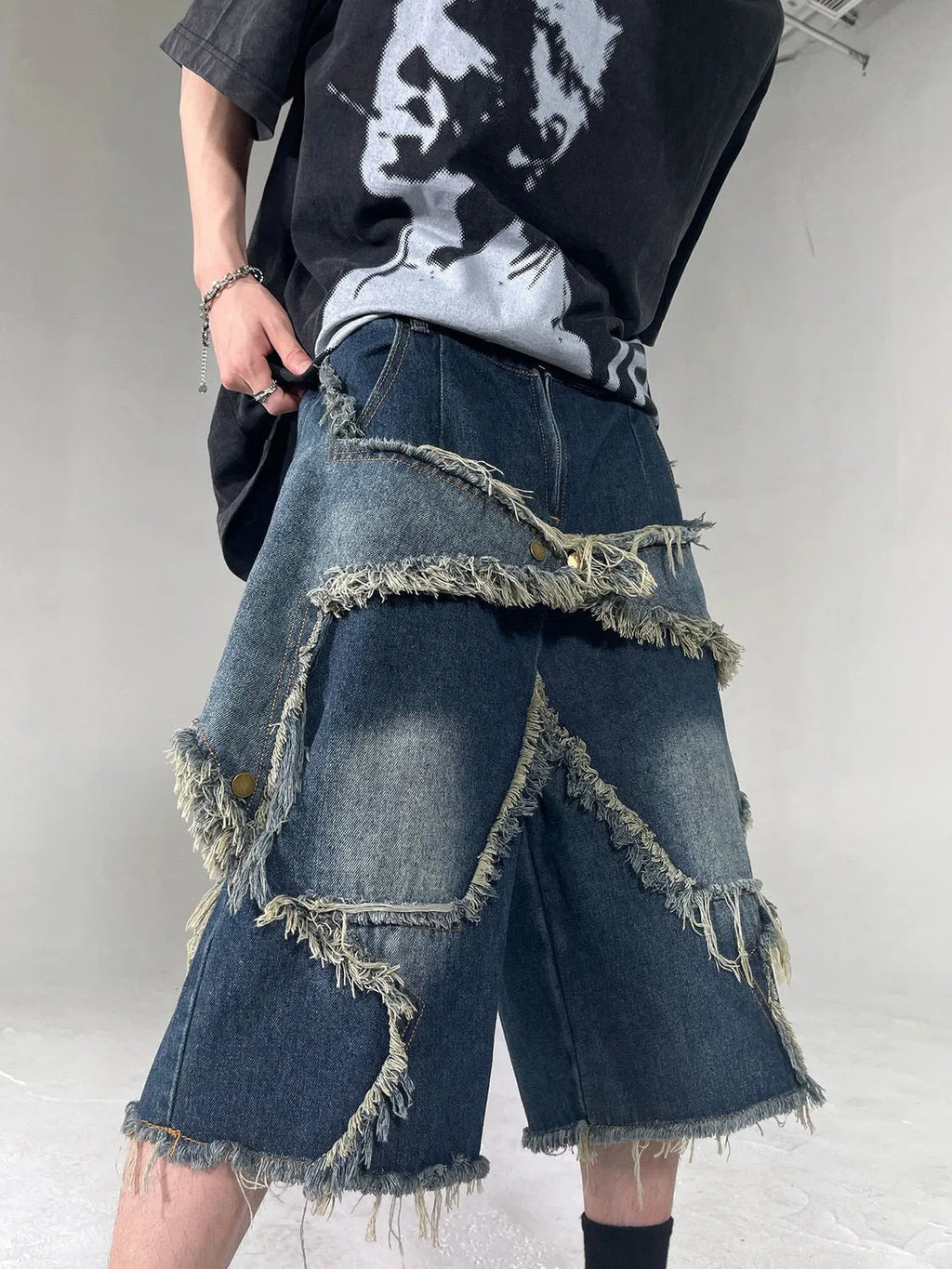Men's blue retro denim shorts with frayed hem and five-pointed star design, loose fit with knee-length styling