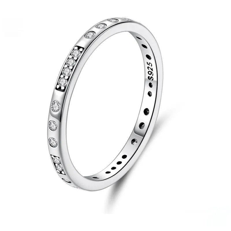 Moss Password I Love You silver ring with oxidised black finish on a model's finger, showing simple bracelet style.