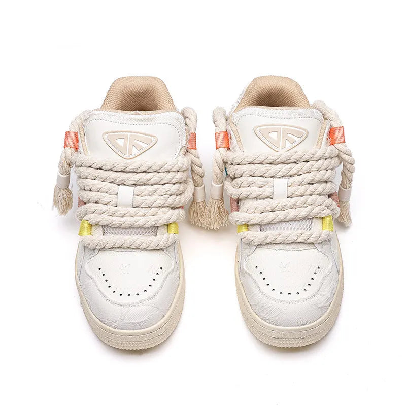 Cream white retro lace-up skateboard shoes with platform sole on a plain background