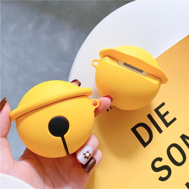 Yellow silicone AirPods case with a small silver bell charm attached