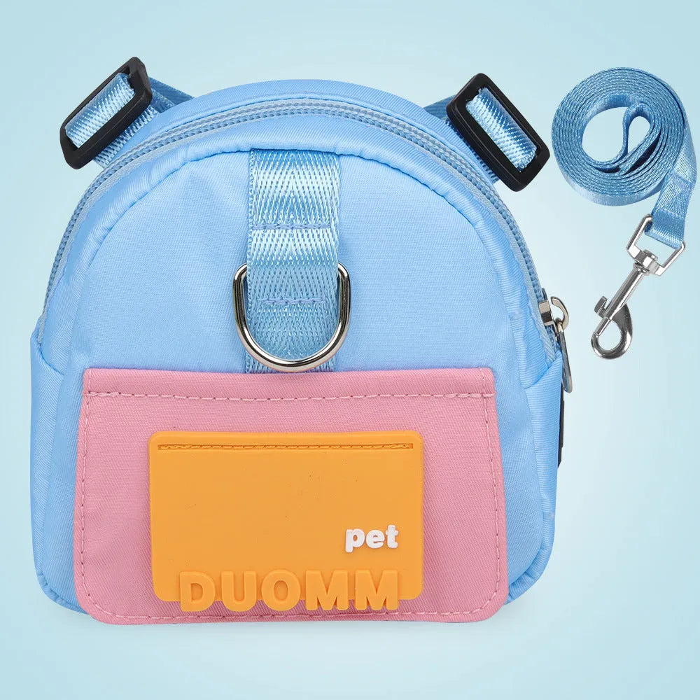 Blue adjustable dog backpack harness with breathable mesh and detachable tow rope on medium-sized dog