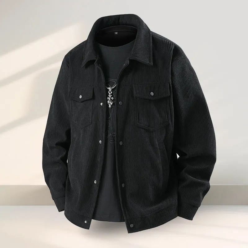 Men's slim-fit black lycra coat with ruffle detailing on a hanger.