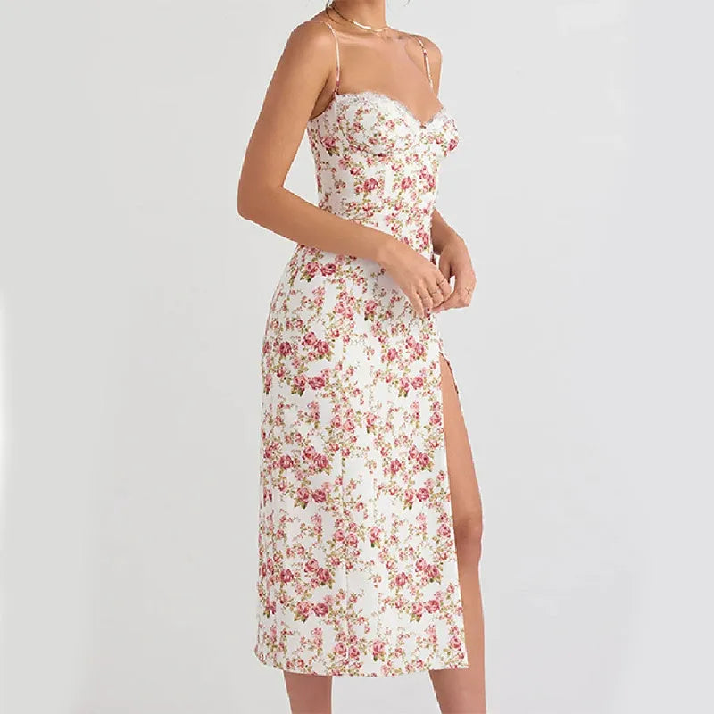 Women's long dress with lace flowers print, thigh-high slit, and suspender straps in blue.