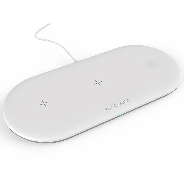 White three-in-one wireless charging station for Apple iPhone, iWatch and headphones on a desk.