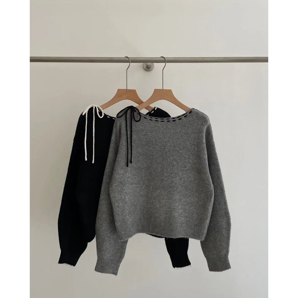 Women's loose grey knitwear pullover jumper on a hanger
