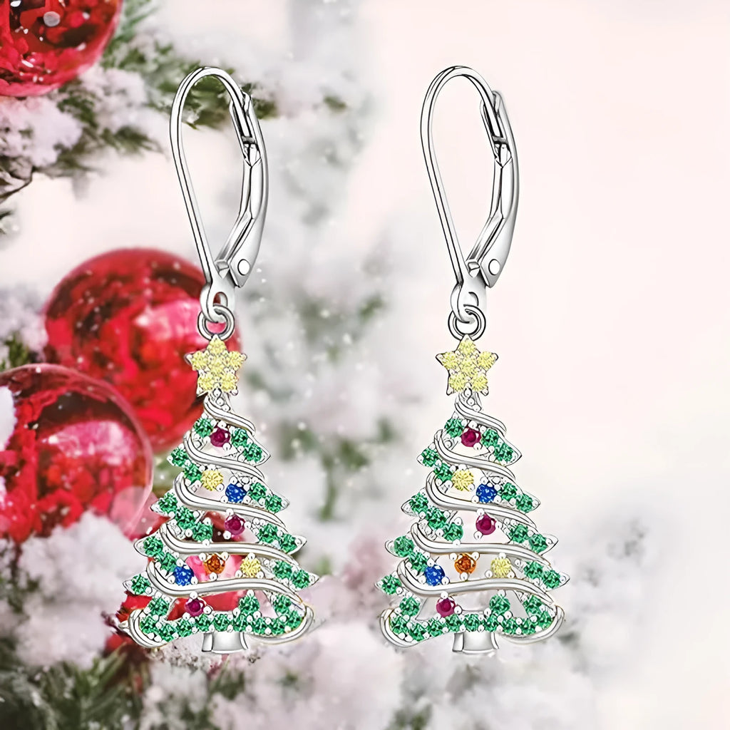 A pair of women's Christmas tree earrings with a star pendant shape in a white gold colour finish.