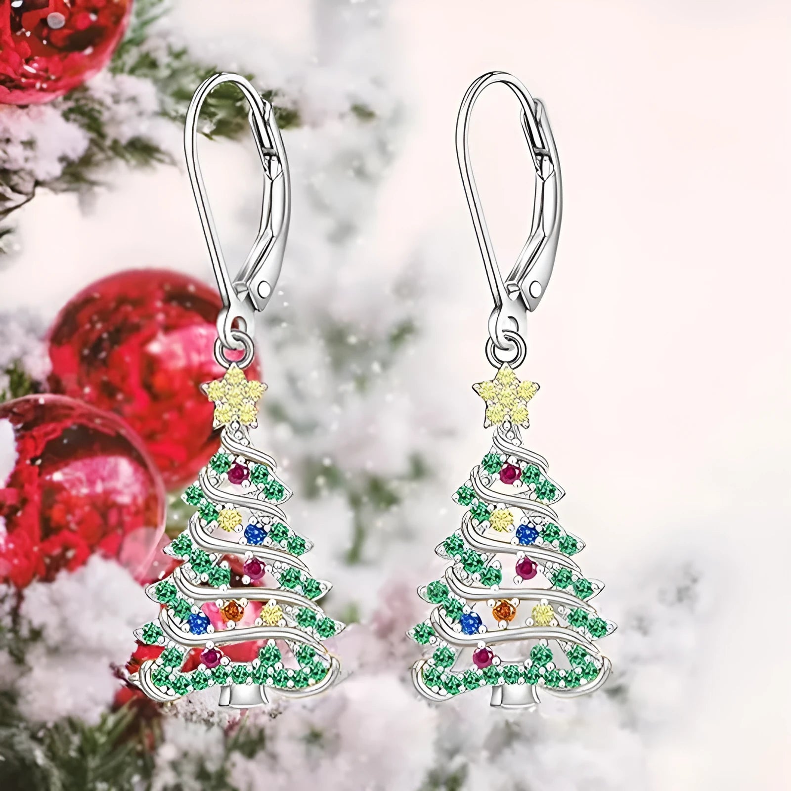 A pair of women's Christmas tree earrings with a star pendant shape in a white gold colour finish.