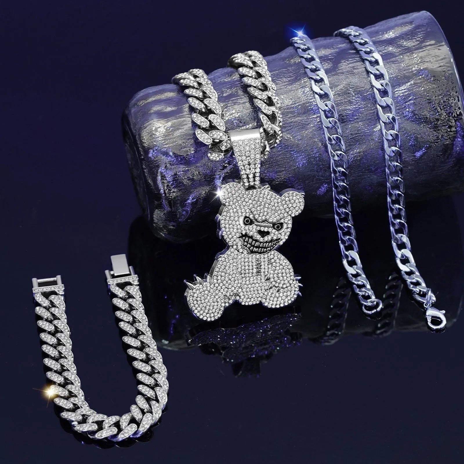 Gold three-piece jewellery set with rhinestone bear pendants on Cuban link chain necklaces and bracelet
