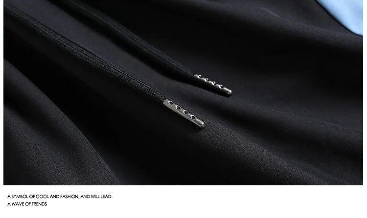 Men's black quick-drying sports shorts with grey contrast panels and elastic waistband