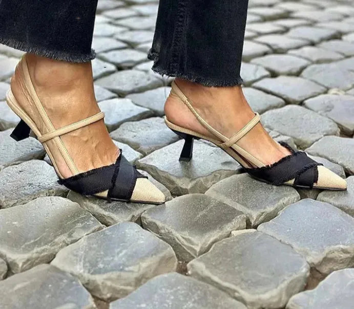Women's apricot and black colour block stiletto heel sandals with a pointed toe and buckle fastening.