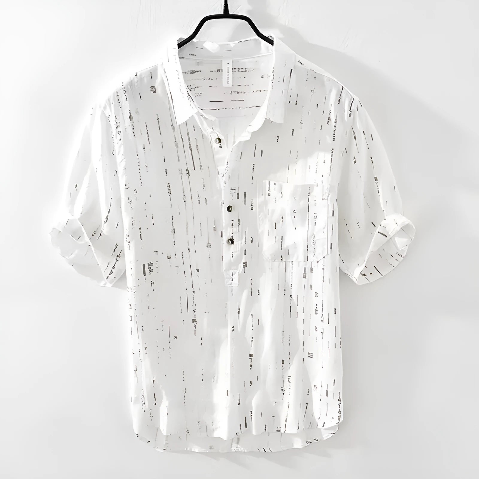 Men's loose fit short sleeve polo shirt in black, shown on a hanger.