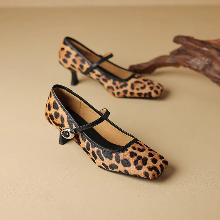 Women's black square toe stiletto heel ankle-strap shoes with horse hair upper and buckle closure.