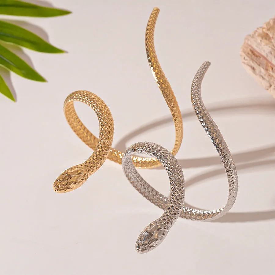 Gold twisted snake ring and bracelet set with exaggerated winding design