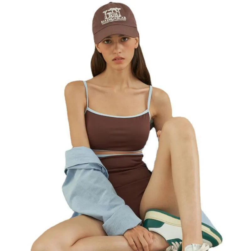 Brown women's one-piece swimsuit with a triangle top on a mannequin.