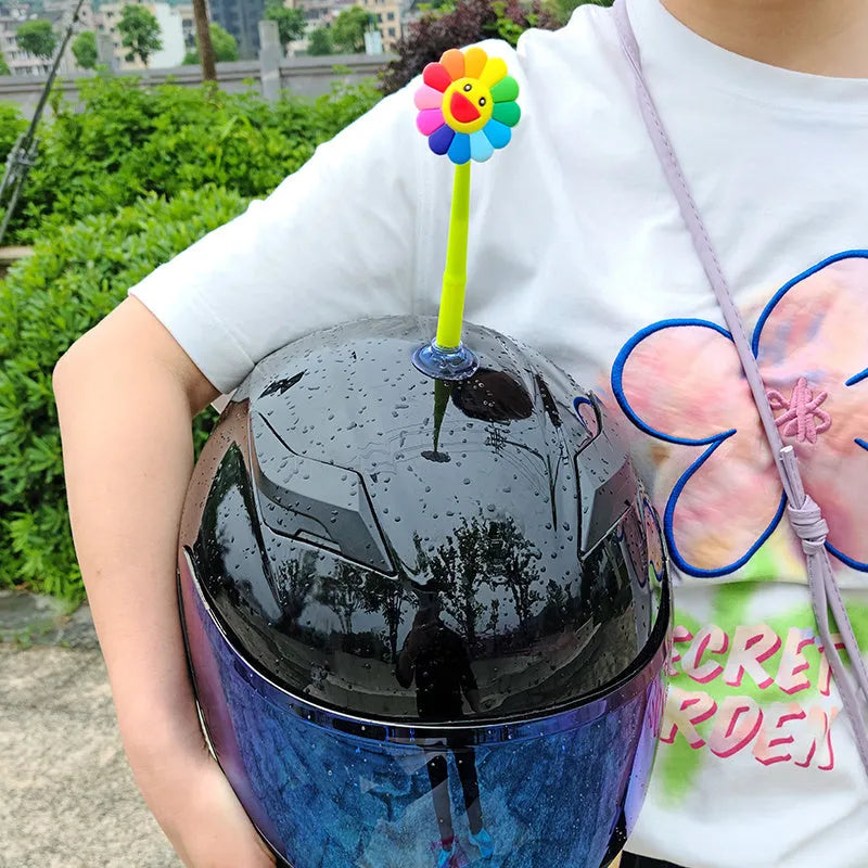 Silicone swinging sunflower decoration with suction cup for motorcycle and bicycle helmets.