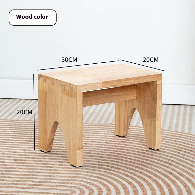 Distressed brown wooden stool with bracket legs for changing shoes
