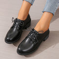 Black women's low-top work shoes with chunky heel and soft leather sole