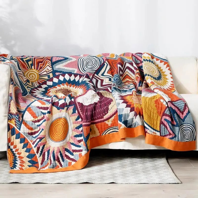 Five-layer pure cotton gauze bed blanket in modern simplicity style, shown in blue roulette wheel pattern.