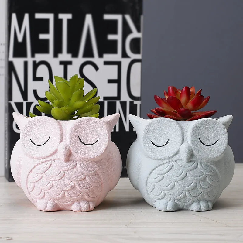 Handmade frosted ceramic succulent pot with cartoon owl design, shown in light pink.
