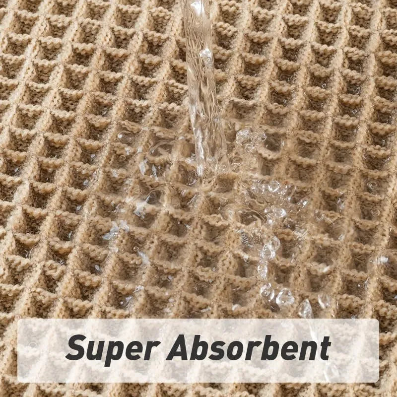Beige and white checkered woven polyester bathroom floor mat on tiles.