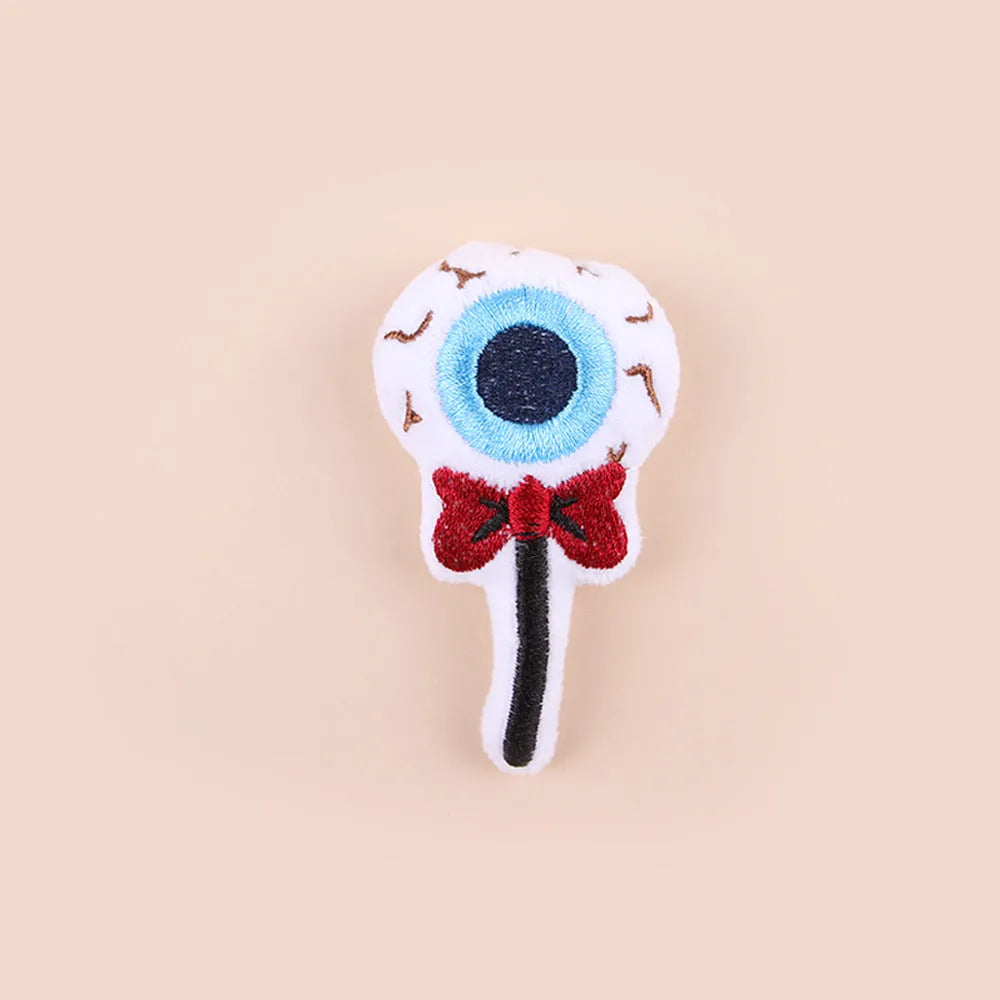 Small plush cat teaser wand with candy character design on flexible string