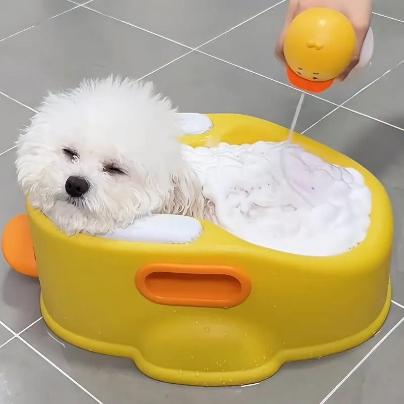 Blue duck-shaped PVC bathtub for washing dogs and cats on a flat surface.