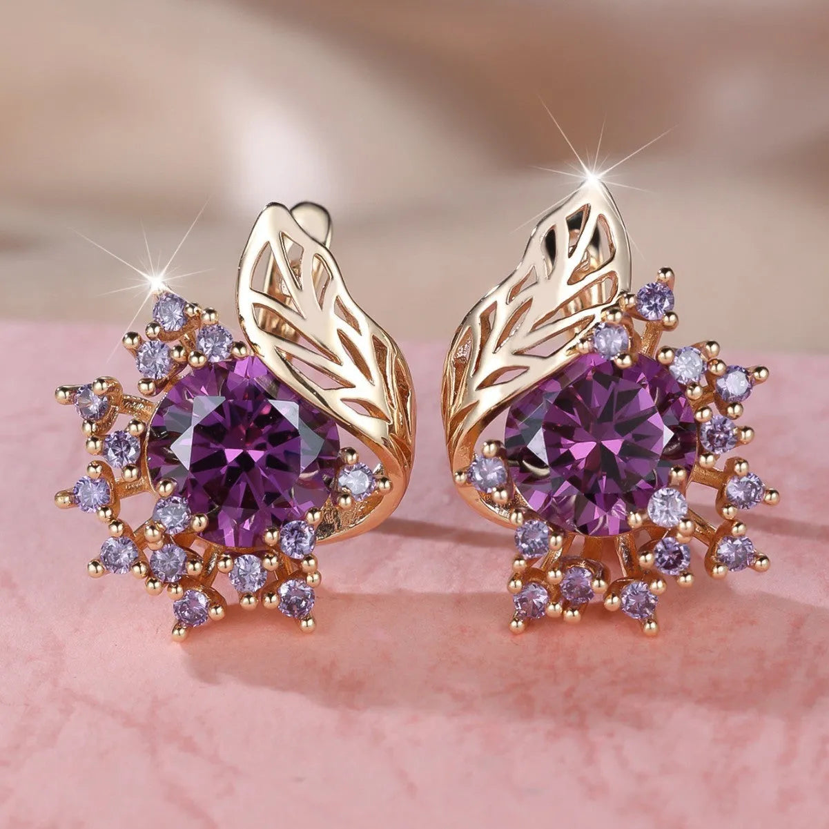 Round flower feather design earrings with champagne gold setting and coloured zircon stones.