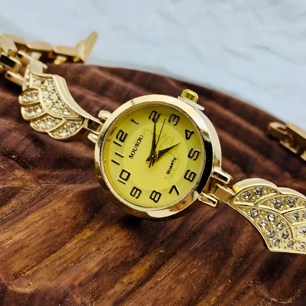 Stainless steel women's watch with round dial on wrist, showing Vachette clasp buckle