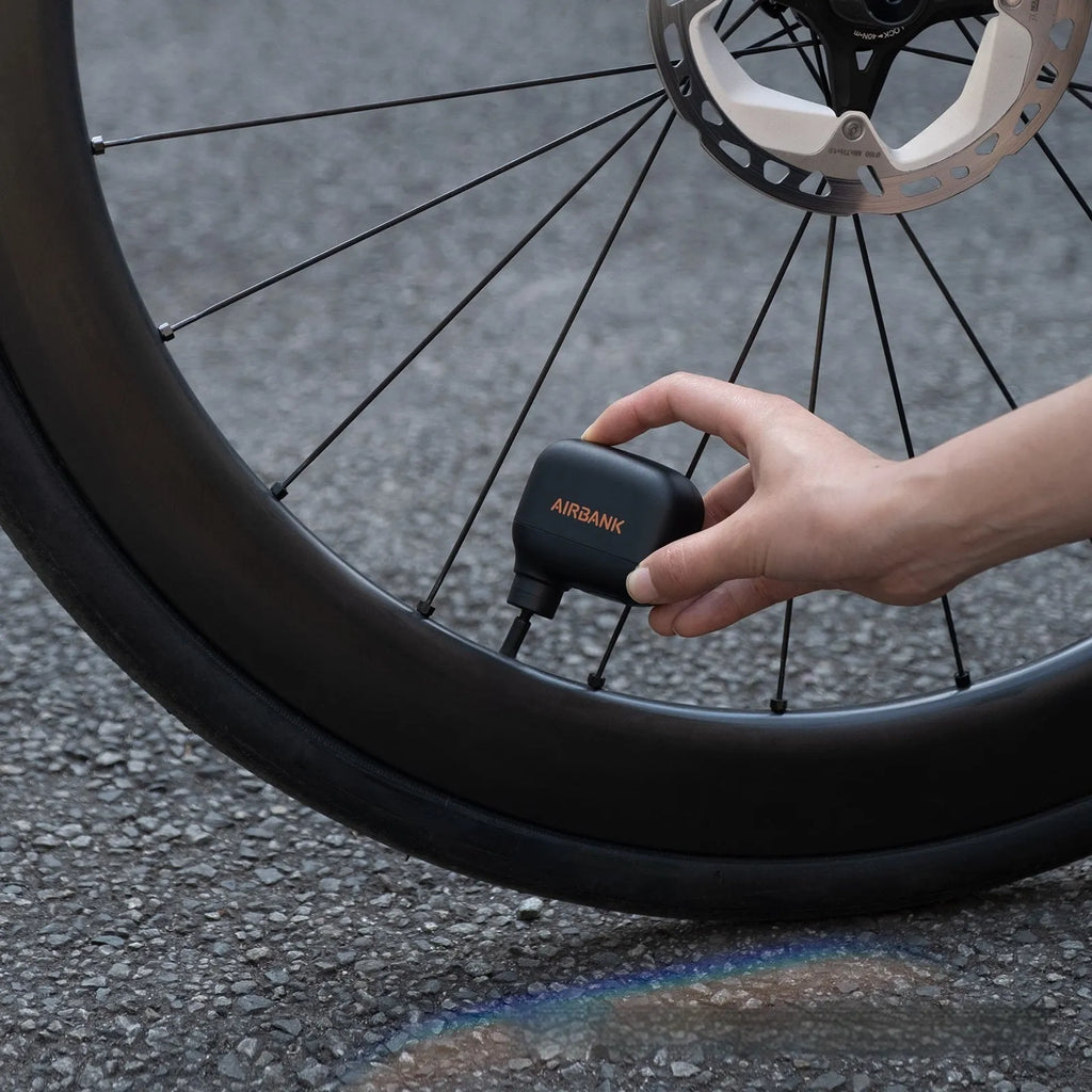 Black AS100 electric bike pump with USB cable and waterproof bag