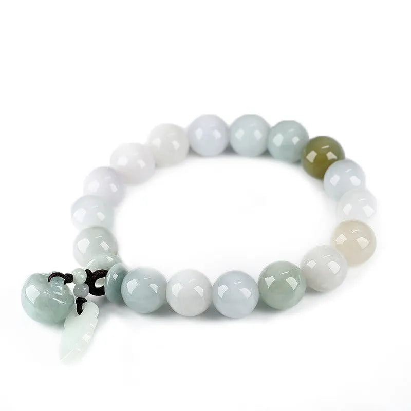 Natural green jade hanging bracelet with Maitreya Buddha pendant on a wrist.