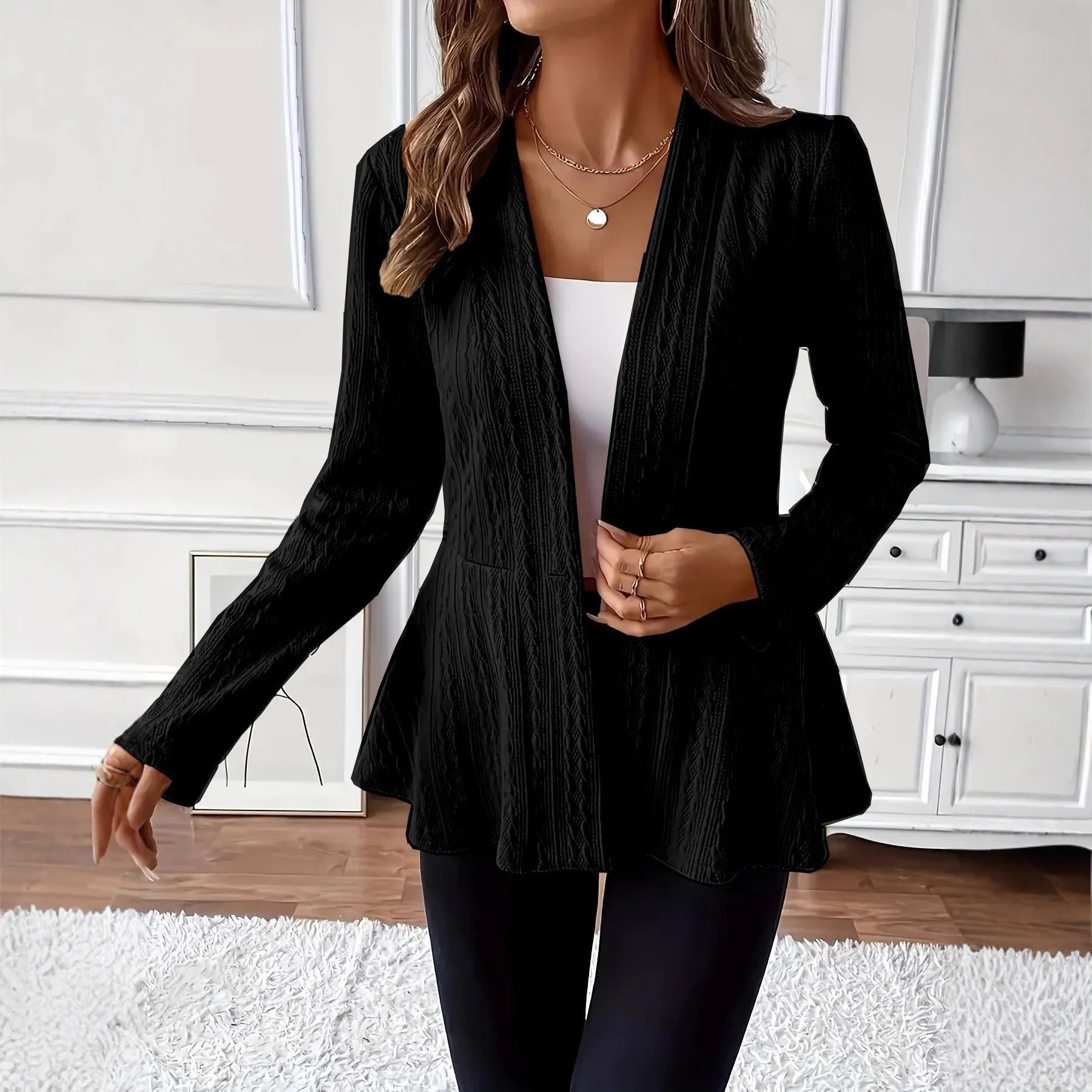 Women's apricot coloured Jacquard patterned knitted cardigan with one button front.