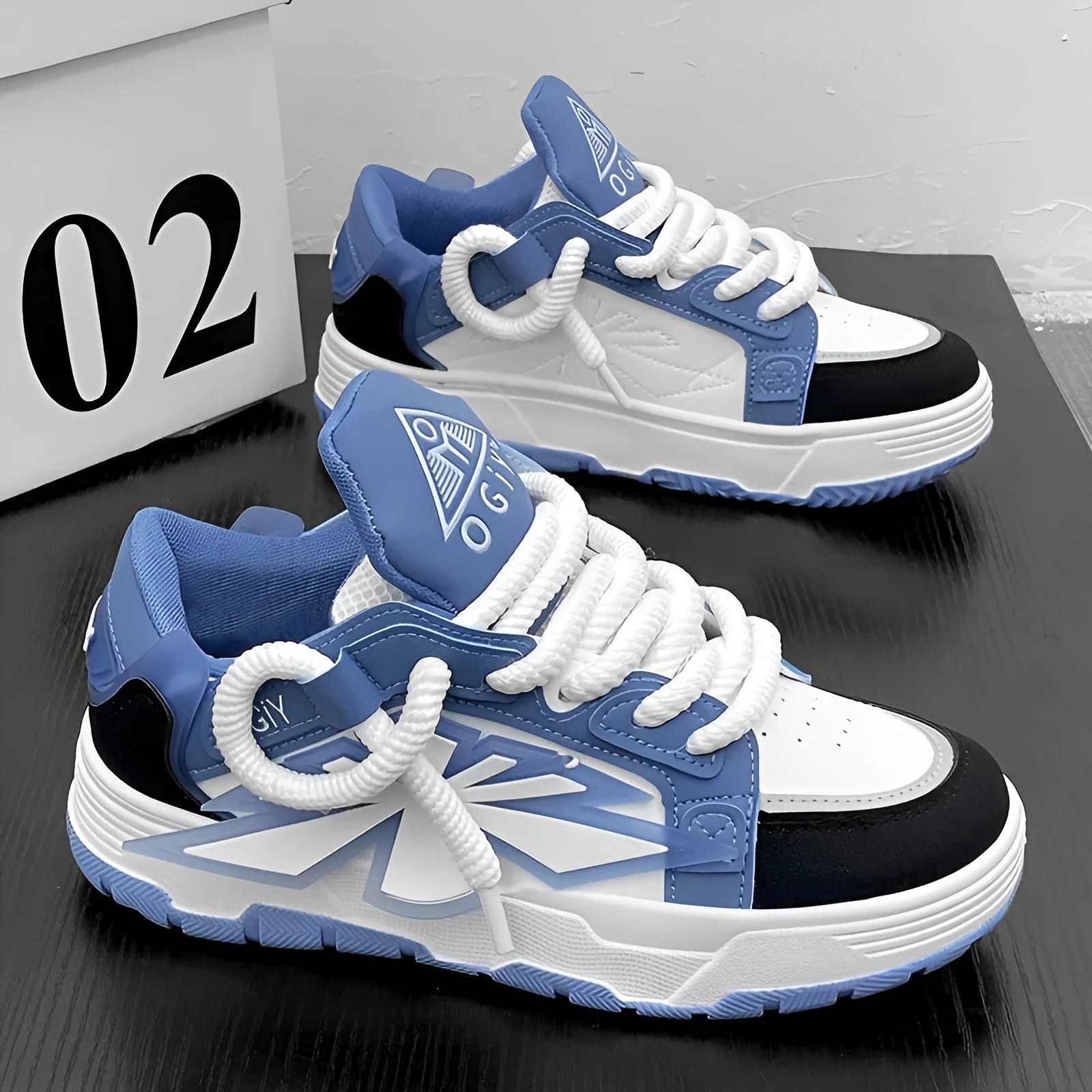 Men's white chunky low-top sneakers with round toe and lace-up front on rubber sole