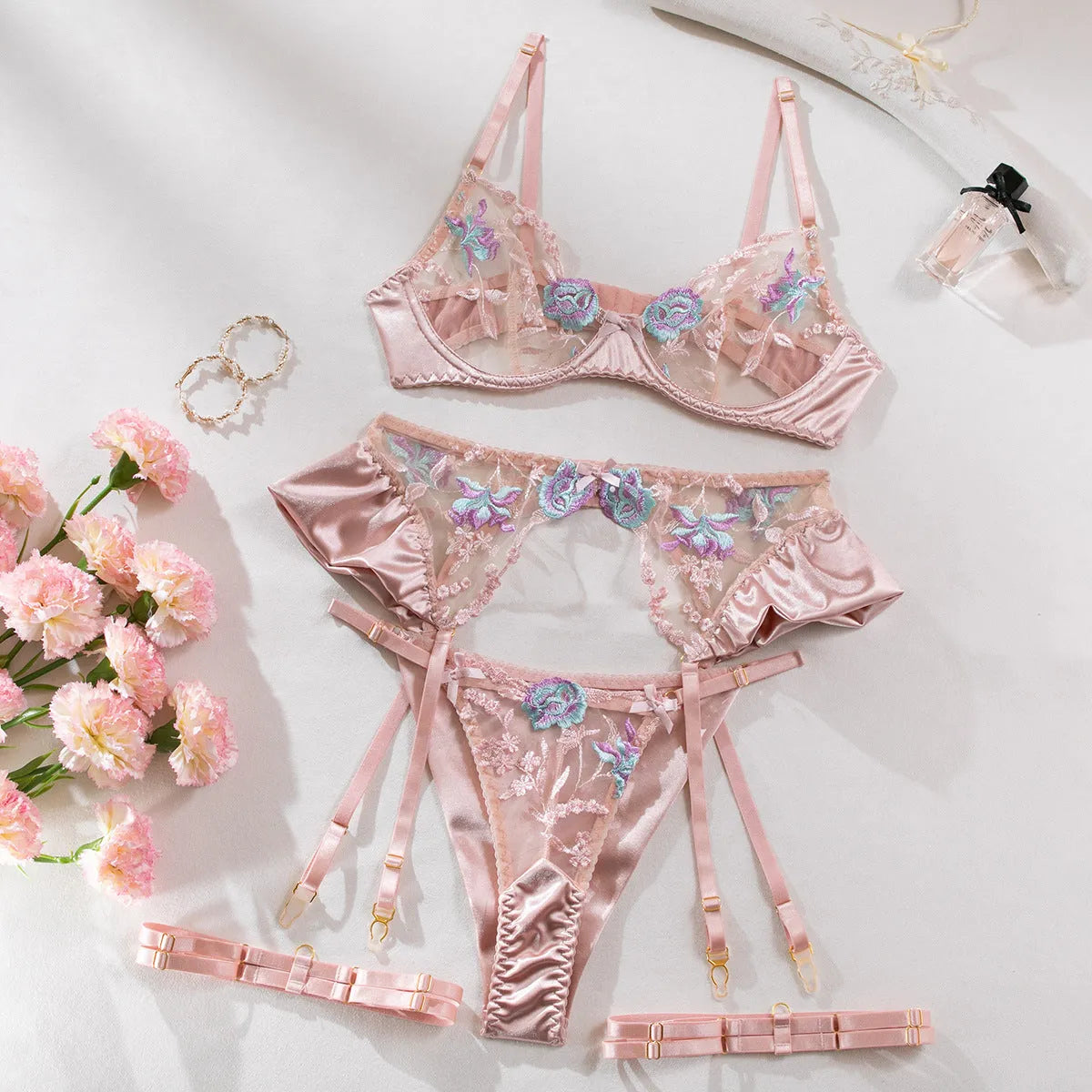 Light purple four-piece satin lingerie set with decorative embroidery