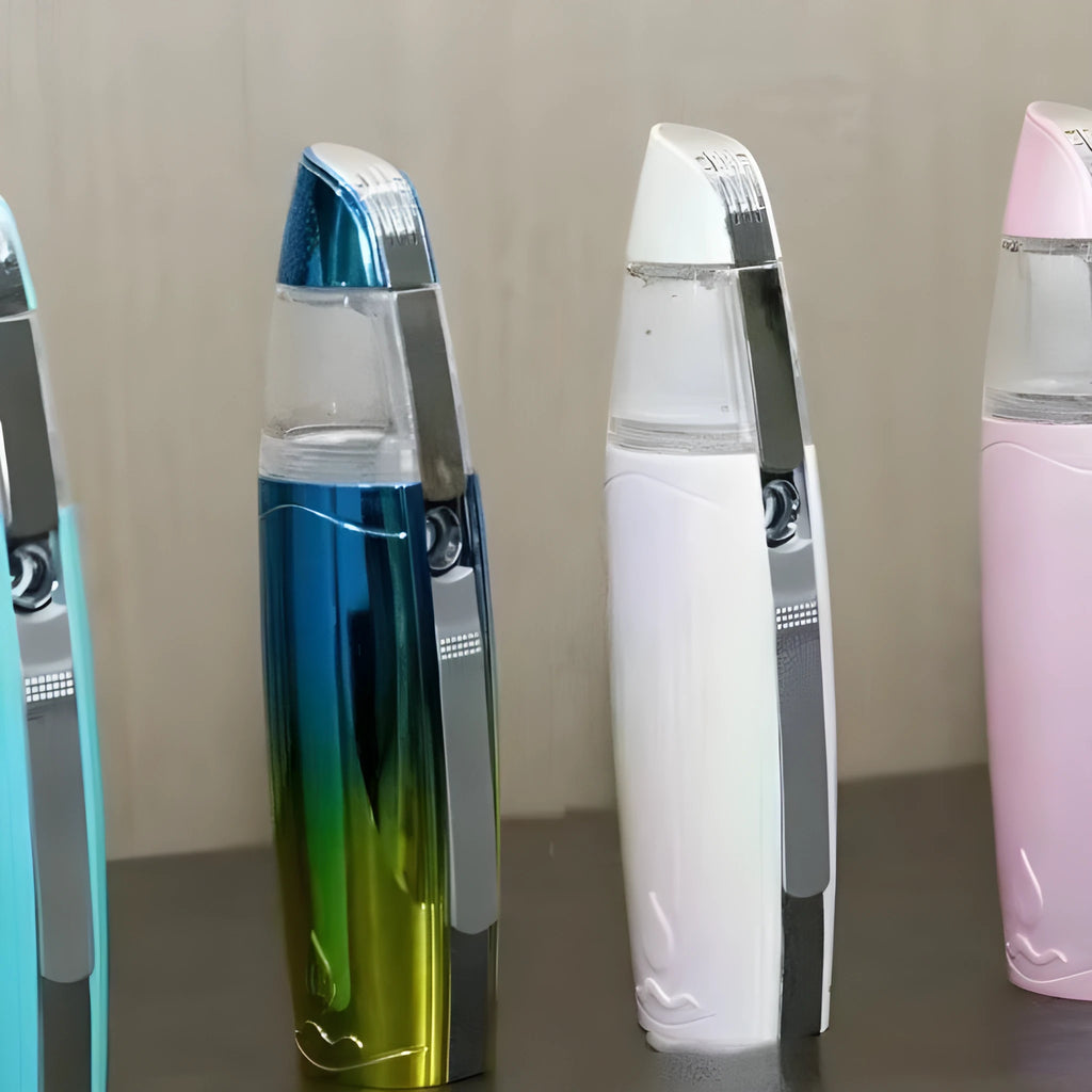 Peacock blue handheld USB rechargeable facial steamer spraying fine mist