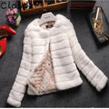 Women's short faux fur top in beige, shown with regular sleeves and a cropped hem.