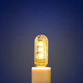 Compact white LED baby night light with USB cable showing warm and white light options