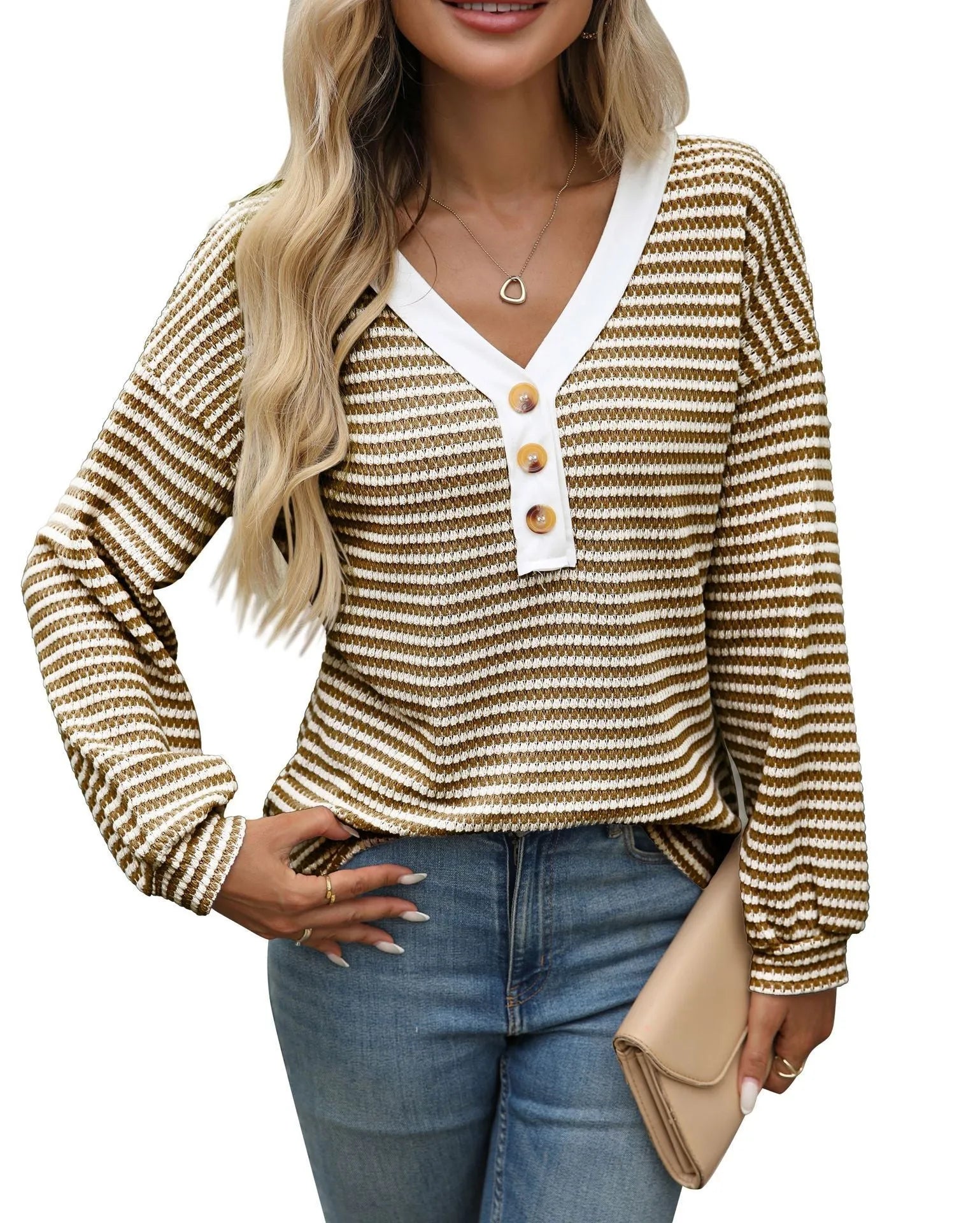 Women's loose-fitting apricot V-neck pullover top with button detail and patchwork design on long sleeves.
