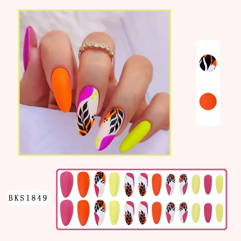 Wear Armour medium almond shaped nail stickers in four frosted patterns: French leaves, leopard print, macarons, and colour plating.