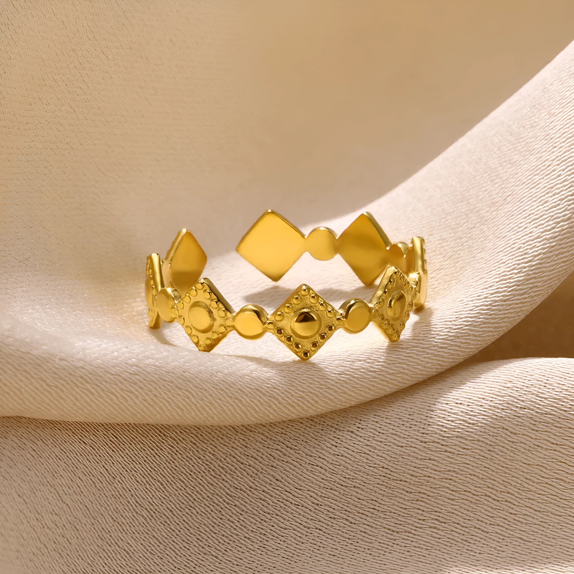 Geometric titanium steel women's ring in a gold diamond colour.