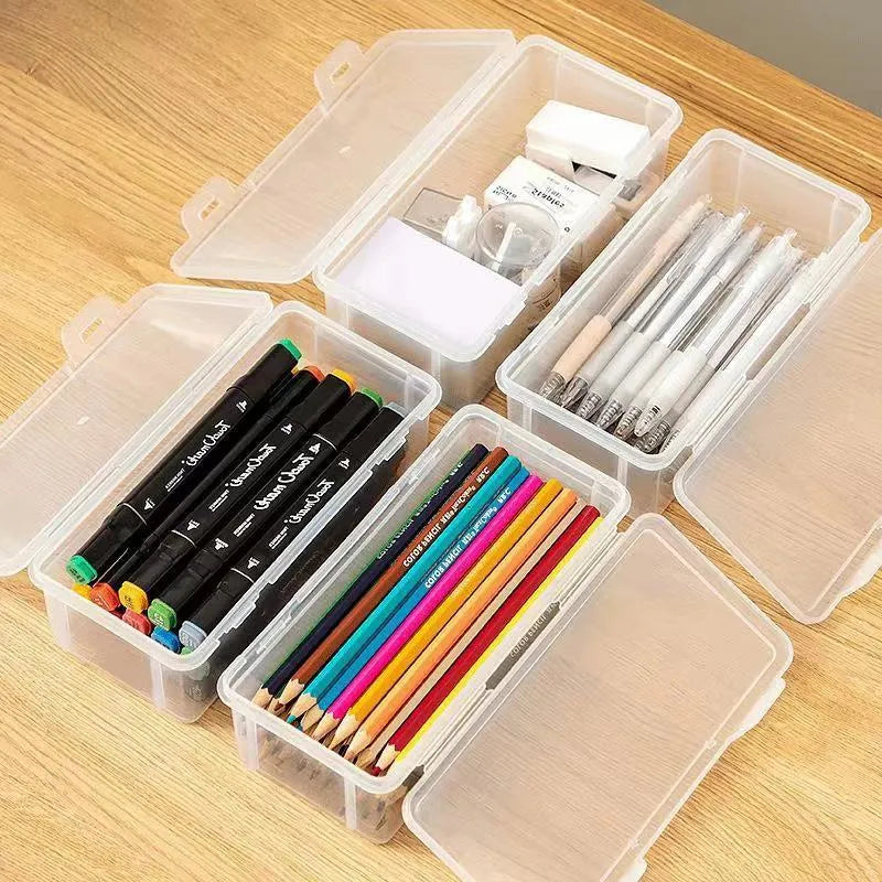 Transparent plastic pencil storage box full of coloured pencils and crayons