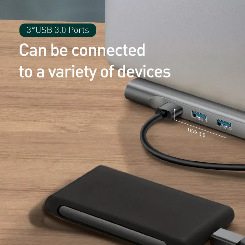 Grey aluminium 10-port docking station with cooling bracket showing HDMI, VGA, USB and Ethernet ports