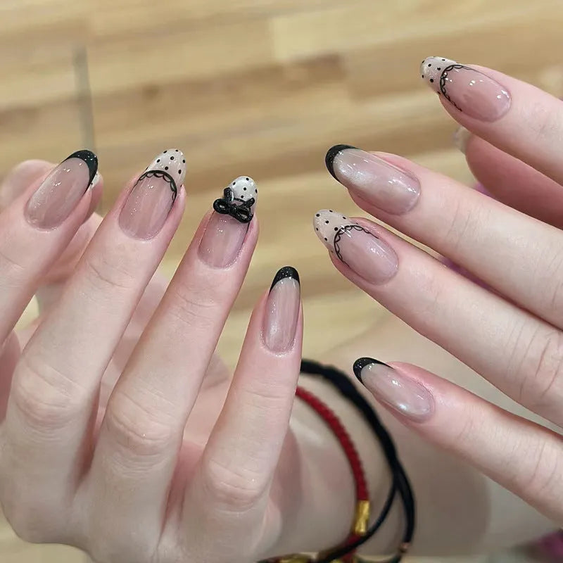 Set of sweet girl themed press-on false nails in assorted random colours and designs.