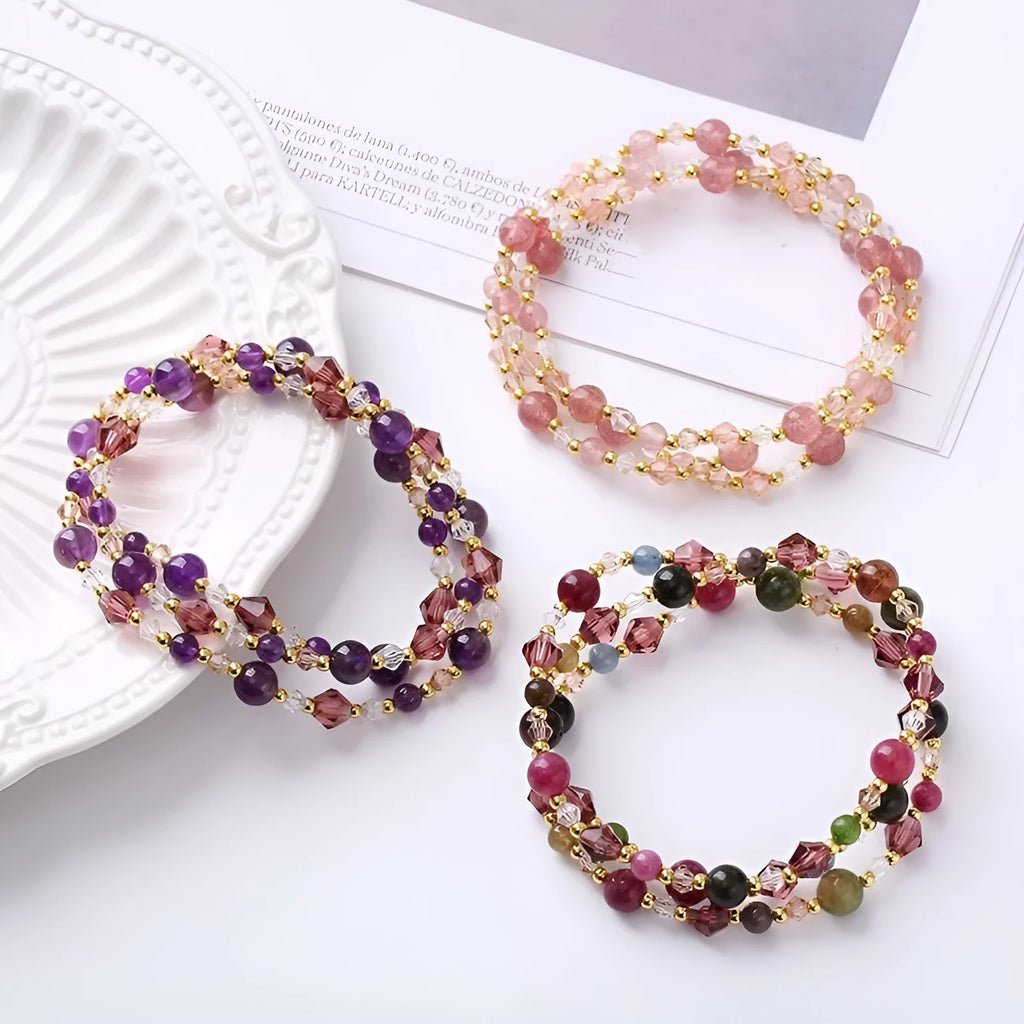Women's adjustable bracelet with three rings of tourmaline, strawberry quartz, and amethyst crystal beads.